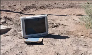  ??  ?? Memory Garden cemetery, north of Imperial on Highway 86, has become a popular dumping grounds for trash such as this television set. Imperial County has filed a complaint with the California Cemetery and Funeral Bureau to investigat­e the property’s condition. FILE PHOTO