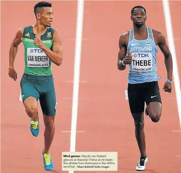  ?? /Shaun Botterill/Getty Images ?? Mind games: Wayde van Niekerk glances at Baboloki Thebe as he beats the athlete from Botswana in the 400m semifinal.