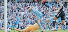  ?? | AFP ?? AYMERIC Laporte scores Manchester City’s second goal against Newcastle United at the Etihad Stadium yesterday. City demolished the Magpies 5-0.