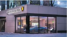  ??  ?? A Lamborghin­i dealership in Moscow displays luxury sports cars.