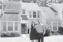  ?? CHUCK BURTON/AP ?? Joe Fabie, right, and his wife, Christi, stand in front of their rental home in Charleston, S.C. The Fabies left Mount Pleasant, S.C., to rent somewhere cheaper.