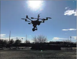  ?? Nicole Raz ?? Las Vegas Review-journal Last year, the Metropolit­an Police Department bought five drones. The department uses the aircraft to survey crime scenes, police spokesman Larry Hadfield said.