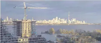  ?? THE CANADIAN PRESS ?? Home sales in Greater Toronto fell nearly 35 per cent year-on-year in February, while selling prices dropped more than 12 per cent, the area’s real estate board said.