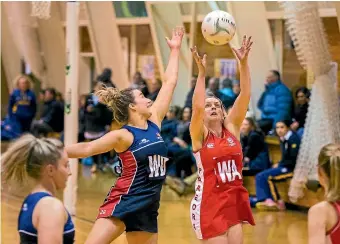  ?? MYTCHALL BRANSGROVE/FAIRFAX NZ ?? Harlequins Macie Austin tries her best to knock the ball from the hands of Pareora’s Katrina Hill.