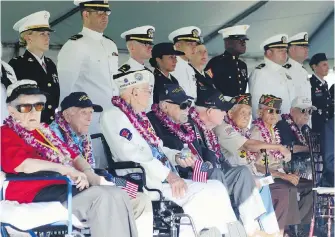  ?? THE ASSOCIATED PRESS ?? Pearl Harbor survivors and active military members take part in a ceremony to mark the 78th anniversar­y of the Japanese attack on Pearl Harbor on Saturday.