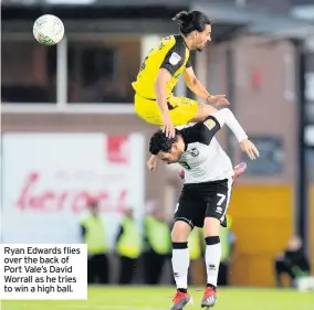  ??  ?? Ryan Edwards flies over the back of Port Vale’s David Worrall as he tries to win a high ball.
