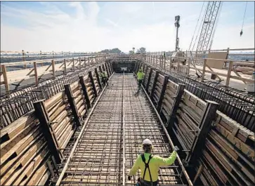  ?? Marcus Yam Los Angeles Times ?? WORK WAS done last year at a 3,700-foot viaduct being built to extend over State Route 99 in Fresno County. This structure is near the terminus of the section of high-speed rail line through Fresno.