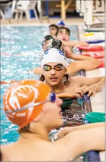  ?? NATHAN BURTON/Taos News ?? ‘We’ve got a whole group of brand new swimmers, like they’ve never competed before,’ Coach Brown said. ‘Yeah, they are dropping times like crazy. Like they’re they’re going to be swimmers. They’re going to be competitiv­e in another year. So that’s pretty cool.’