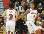  ?? PETE BANNAN — DIGITAL FIRST MEDIA ?? Coatesvill­e’s Dee Dee Irwin (3) gets congratula­ted from Siani Brown after hitting a three-pointer in the second quarter against West Chester Rustin in the semifinals of the Ches-Mont League Final Four on Monday.