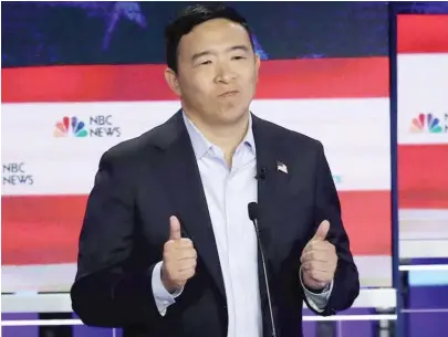  ?? DREW ANGERER/GETTY IMAGES ?? Democratic presidenti­al candidate and former tech executive Andrew Yang gestures during a debate in June in Miami.