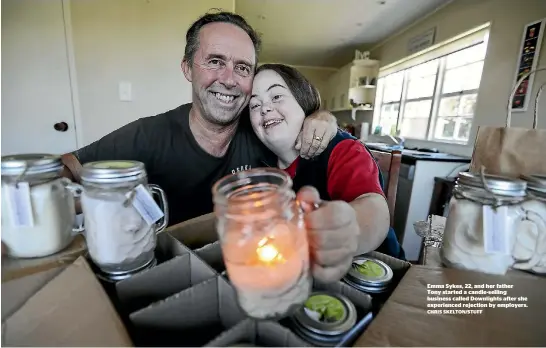  ??  ?? Emma Sykes, 22, and her father Tony started a candle-selling business called Downlights after she experience­d rejection by employers.