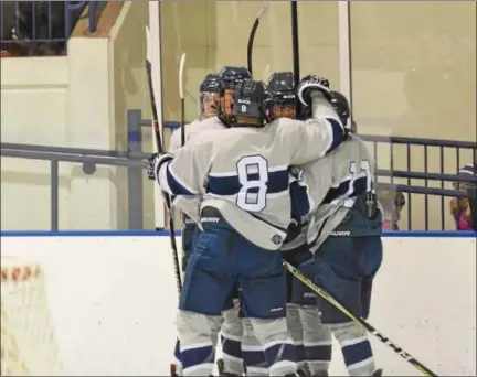  ?? THOMAS NASH — DIGITAL FIRST MEDIA ?? Hill School’s Ryan Long, right, celebrates with teammates after scoring a goal during the third period of Saturday’s game against Lawrencevi­lle. The Blues won 3-0.