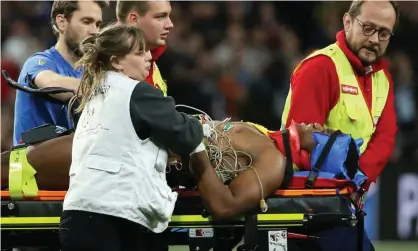  ??  ?? Samuel Ezeala of the Top 14 side Clermont is carried from the pitch after sustaining a head injury in 2018. Photograph: Jean Catuffe/Getty Images