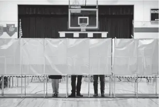  ?? Chang W. Lee, © The New York Times Co. ?? New Hampshire residents vote in the Democratic presidenti­al primary Tuesday at Rye Elementary School in Rye. The Massachuse­tts Institute of Technology is warning about the hacking vulnerabil­ities of the Voatz voting app, which has been tested in Denver.