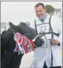  ??  ?? WINNER: Mark Harryman with his Supreme Beef Champion Limousin heifer, Midnight Star.