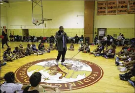  ?? JEFF ZELEVANSKY / GETTY IMAGES ?? Jameel McClain, while still an NFL player in 2015, speaks to high school basketball players in New York City about the need to look beyond their chosen sport and plan for the rest of their lives.