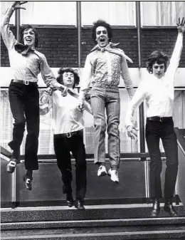  ?? — AP ?? Pink Floyd’s ( from left) Roger Waters, Nick Mason, Syd Barrett and Richard Wright leaping from the steps of EMI House in London in March 1967. The first major retrospect­ive of the British prog rock giants will be held at London’s Victoria and Albert...
