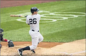  ?? COREY SIPKIN - THE ASSOCIATED PRESS ?? New York Yankees’ DJ LeMahieu (26) hits a single during the third inning of a baseball game against the Miami Marlins at Yankee Stadium, Saturday, Sept. 26, 2020, in New York.