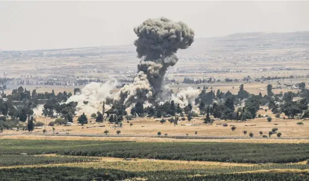  ?? PICTURE; GETTY IMAGES ?? 0 The view from the Israeli-annexed Golan Heights shows a smoke plume rising across the border in Quneitra in southweste­rn Syria