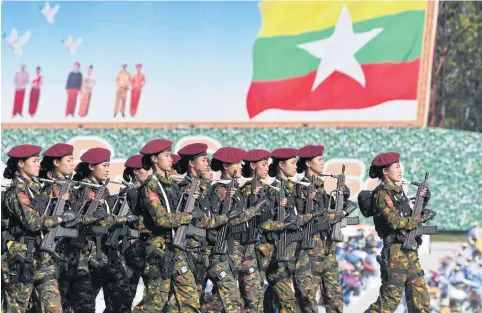  ?? AFP ?? Members of the Myanmar military march at a parade ground to mark the country’s Independen­ce Day in Nay Pyi Taw on Jan 4.