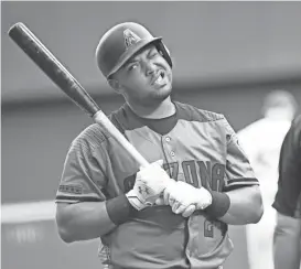  ?? BENNY SIEU/USA TODAY SPORTS ?? Diamondbac­ks left fielder Yasmany Tomas reacts after being called out on strikes in the seventh inning during the game against the Milwaukee Brewers at Miller Park. The D-Backs did not get a hit until the eighth inning.