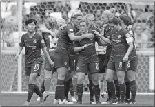  ?? LAURENT CIPRIANI/AP PHOTO ?? In this file photo from April 21, 2019, Chelsea’s Erin Cuthbert, centre, and teammates celebrate scoring against Lyon during their Women’s Champions League soccer match in Decines, France.