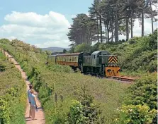  ?? PETER NICHOLSON ?? Newly returned to service on the West Somerset Railway following withdrawal for attention in 2019, Class 14 No. D9526 heads past Splash Point on the approach to Watchet on May 29. This was the
ECS with 4-6-0 No. 7828 Odney Manor on the rear, going back to Watchet having swapped the locos around at Williton so the 13.45 Watchet to Bishops Lydeard would be steamhaule­d throughout. This was just one of two trains run each day over weekend, ‘Crompton’ No. D6566 performing the diesel duty on the Sunday.