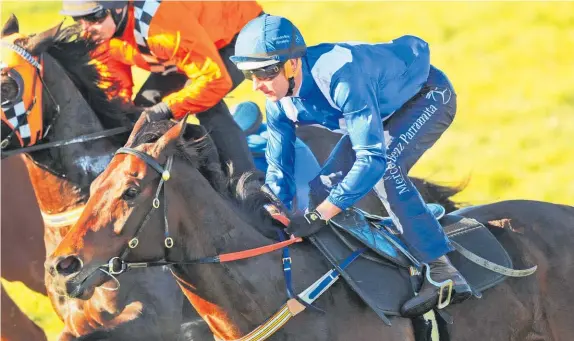  ?? Photo / Getty Images ?? Hugh Bowman says Winx extended nicely and ran through the line well at yesterday’s trial.