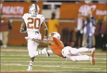  ?? RICK BOWMER — THE ASSOCIATED PRESS ?? Stanford running back Bryce Love runs for a touchdown as Utah’s Marquise Blair misses a tackle during the Cardinal’s 23-20 victory on Saturday night.