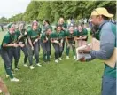  ?? JEFFREY F. BILL/BALTIMORE SUN MEDIA ?? The Wilde Lake softball team is presented with the regional softball championsh­ip plaque after beating Reservoir, 7-5, in the Class 3A East Region II final on Wednesday.