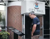  ?? CHAD HIPOLITO / THE CANADIAN PRESS ?? A plaque outside city hall in Victoria, B.C., which replaced a bronze statue of Sir John A. Macdonald, was vandalized after the removal of the statue over the weekend.