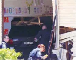  ??  ?? Police inspect the vehicle in the Sydney suburb of Greenacre yesterday.