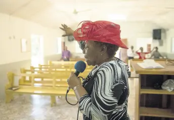  ?? PHOTO EDITOR GLADSTONE TAYLOR/MULTIMEDIA ?? The Rev Carmen Lewis ministers at the third session of Easter services at the Mount Salus New Testament Church in St Andrew on Sunday. Earlier, two sessions were held simultaneo­usly, bringing the total attendance for Easter Sunday services to 30.