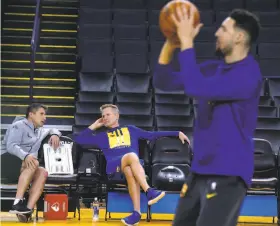  ?? Paul Chinn / The Chronicle 2019 ?? The return of sports will create health risks for athletes. At top, players wear masks before a Korean league baseball game; above, Dr. Rick Celebrini (shown talking with Warriors head coach Steve Kerr as Klay Thompson shoots during practice last year) might have an expanded role when the NBA returns.