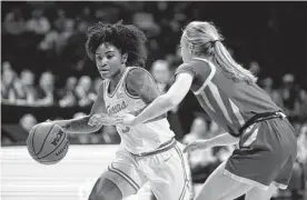  ?? Colin E. Braley/associated Press ?? Texas guard Rori Harmon, left, getting past Iowa State’s Denae Fritz, said the Longhorns can’t make excuses for any hardships the team is dealing with.