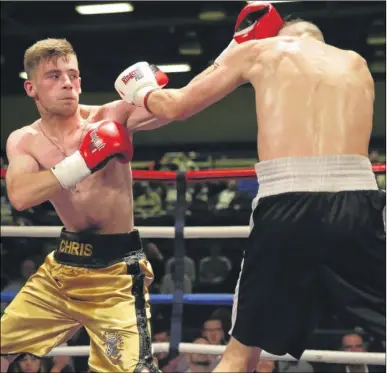  ?? Pictures: Countrywid­e Photograph­ic ?? Chris Matthews connects with Roland Farago on his way to a points victory in the four-round lightweigh­t bout