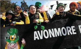  ??  ?? Members of Avonmore FC marching in the parade.