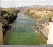  ??  ?? This Feb. 19 photo shows Colorado River water running through farmland on the Colorado River Indian Tribes reservatio­n in Parker, Ariz.