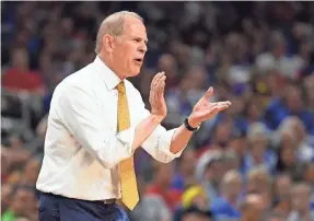  ??  ?? Coach John Beilein and Michigan lost the NCAA title game to Louisville in 2013. Scandal-ridden Louisville was stripped of the title.