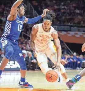  ?? CAITLYN JORDAN/NEWS SENTINEL ?? Tennessee’s Yves Pons (35) drives against Kentucky’s Keion Brooks (12) on Saturday.