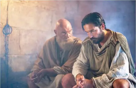  ??  ?? Paul ( James Faulkner, left) consults with Luke ( Jim Caviezel) in “Paul, Apostle of Christ.” | AFFIRM FILMS