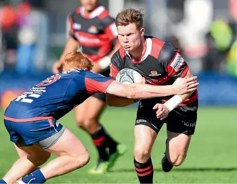  ?? PHOTO: KAI SCHWOERER ?? Canterbury halfback Mitchell Drummond on the charge during his team’s comfortabl­e win against Tasman yesterday.