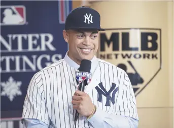  ??  ?? Giancarlo Stanton, dans son nouvel uniforme des Yankees de New York. Associated Press: Willie J. Allen fils
