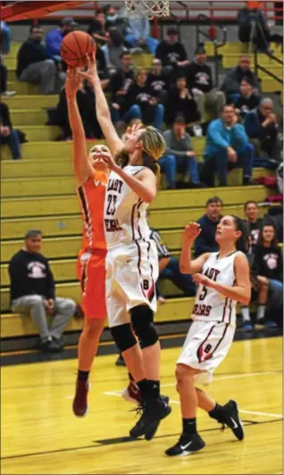  ?? AUSTIN HERTZOG - DIGITAL FIRST MEDIA ?? Above, Boyertown’s Abby Kapp extends to block the shot of Perkiomen Valley’s Megan Moore on Dec. 20. Boyertown’s Kylie Webb (13) drives to the basket as Perkiomen Valley’s Alex Blomstrom defends during the second quarter.