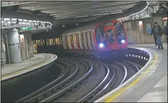  ??  ?? A train pulls into Westminste­r Undergroun­d station.