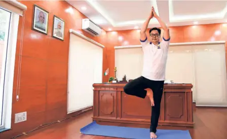  ?? PARAS MENDIRATTA ?? Keeping in touch: The minister keeps himself fit with a few yoga exercises. “I interacted with athletes across various sporting discipline­s through an online video conference, I found most of them to be very positive,” he says.