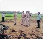 ?? HT PHOTO ?? Police investigat­e at the site where a boy was killed and cremated by his father and grandfathe­r in Bharatpur .