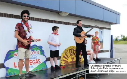  ?? JEN L DAVIES ?? Children at Brackla Primary School join Elvis impersonat­or Juan Lozano on stage
