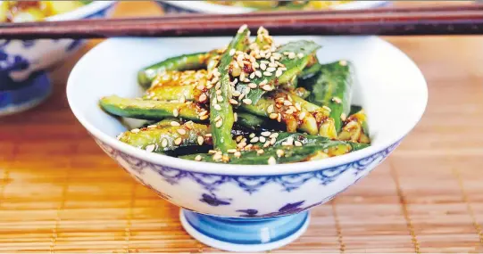  ?? PHOTOS: KAREN BARNABY ?? Nothing beats a cool cucumber salad in the summer. This Sichuan version lets you turn up the heat by adding a little — or a lot — of chili oil.