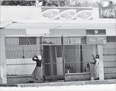  ??  ?? The picture taken recently in New Magwegwe shows women painting a shop which is yet to open as they seek to fend for their families. Women have defied all odds and ventured into the once- male dominated jobs as they are determined to uplift themselves...